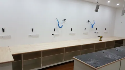 The perimeter bench and its power outlets are now in place.