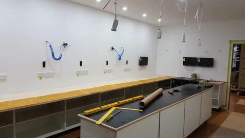 One benchtop is prepared for its covering while the island surface is already in place.