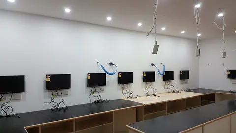 Monitors are installed along the wall.