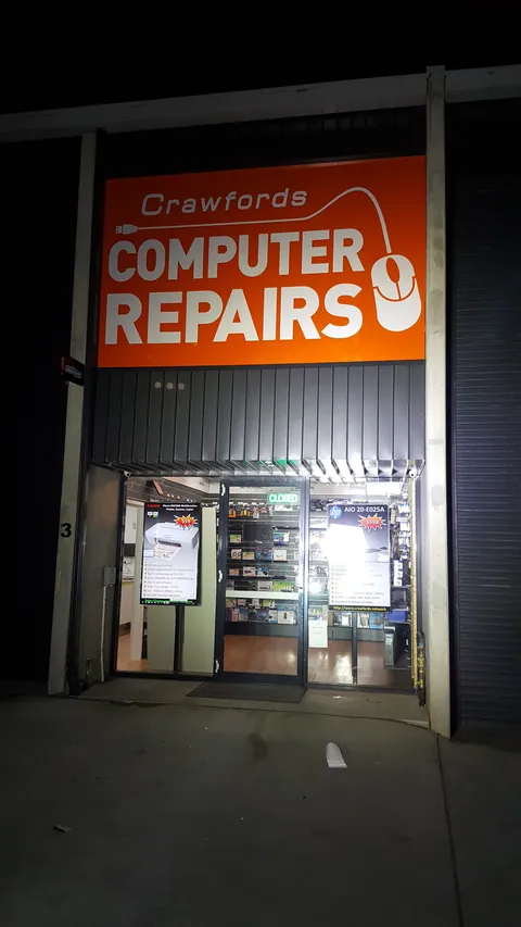 The completed frontage is illuminated after dark.