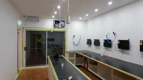 The fitted workshop is photographed with its benches and equipment in place.