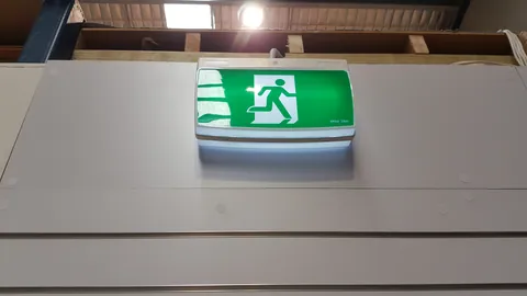 The illuminated exit sign records another detail of the finished fitout.