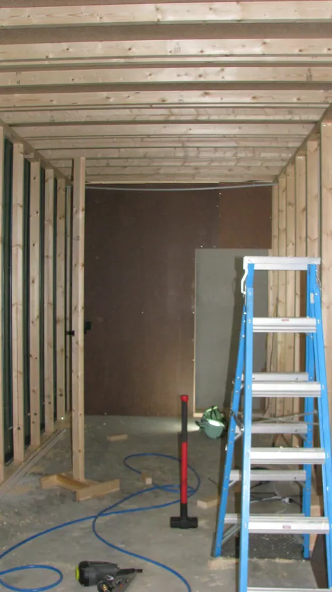 Lining progresses along the side of the room.