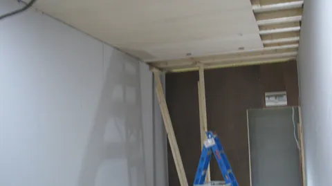 The ceiling is almost covered, with a strip still open at the side.