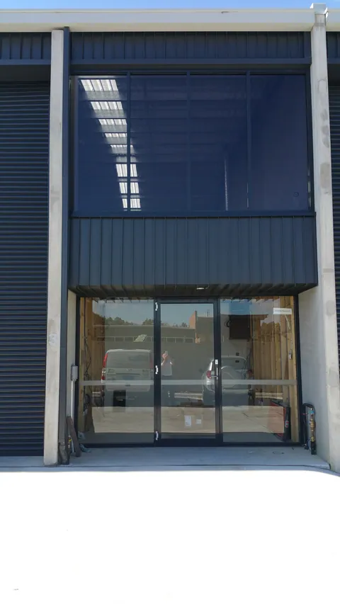 The blue Mitchell shopfront, before the later signs and displays.