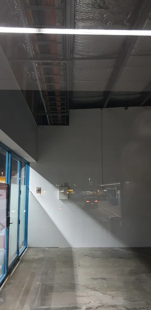 Looking through the front glazing into the empty unit.