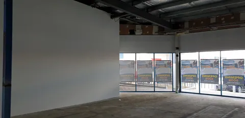 Looking towards the shopfront across the clear floor.