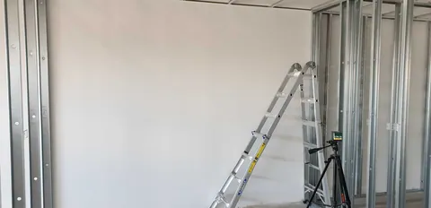 Further partition framing around the ladders and work area.