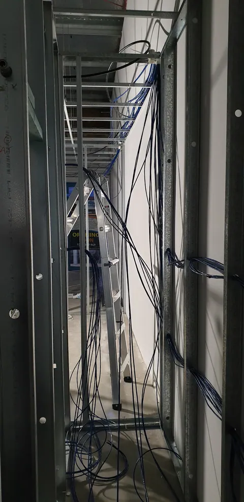 Cables gathered within the new wall framing.
