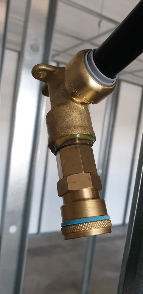 A close view of the compressed-air fittings being prepared.