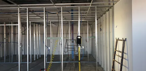 The framed passage and door openings between the rooms.