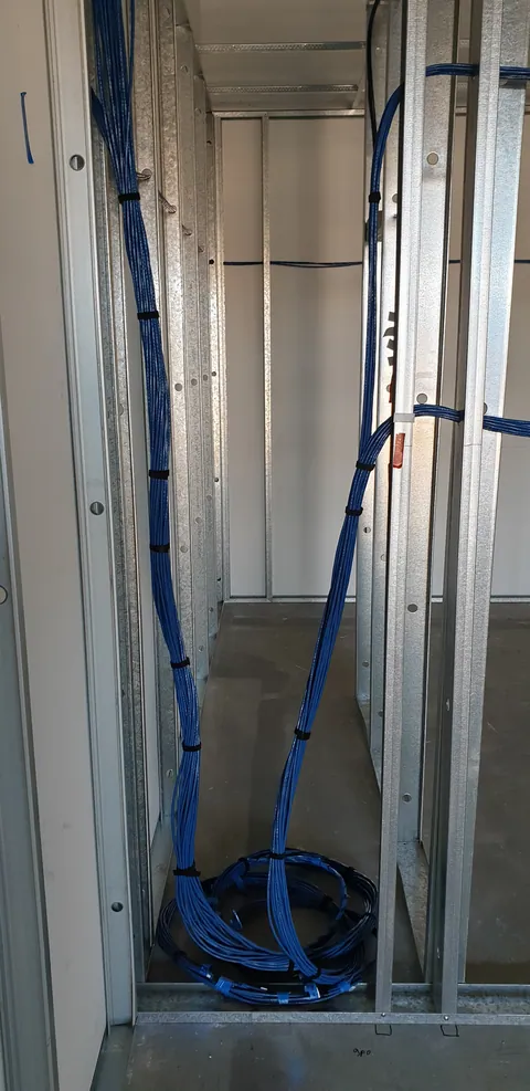 Blue service lines running through the new partitions.