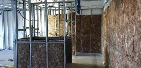 Insulation added around a corner of the new rooms.