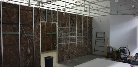 The future retail area with construction tools and materials still out.