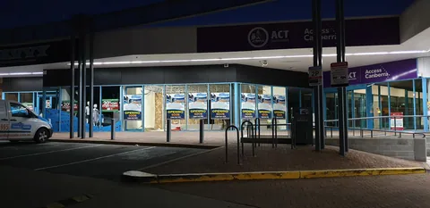 The shop lit from within during the evening build.