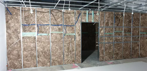 The new partition and doorway seen from the retail area.
