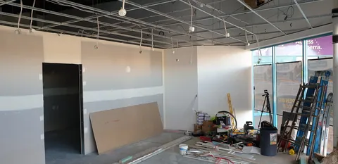 Looking towards the front windows from the newly lined shop.
