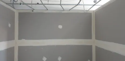 The workshop after the first wall-lining stage.