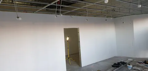 Painting begins on the retail walls.