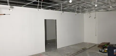 The retail walls after another evening of painting.