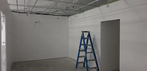 The workshop with painted walls and ladders still in use.