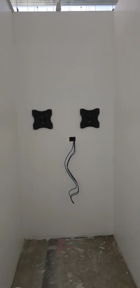 Two screen mounts prepared in a smaller work area.