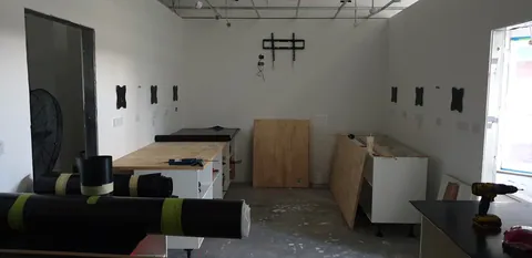 The opposing run of base cabinets and work area.