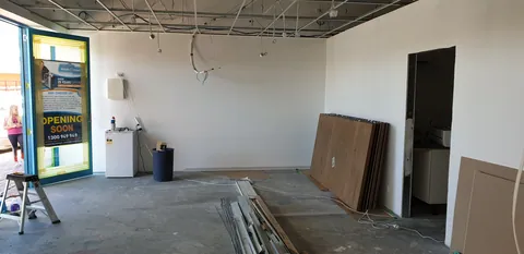 Materials and panels set out across the retail floor.