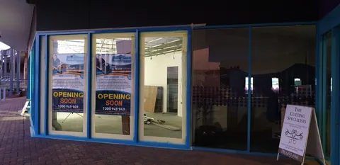 The illuminated shopfront after another evening of work.