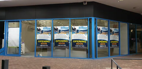 The front-window finishing work nearing completion.