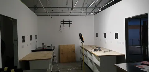 Benchtops fitted to the workshop base cabinets.