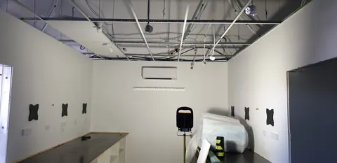 Ceiling panels being added above the workshop.