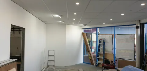 Looking towards the front beneath the finished retail ceiling.