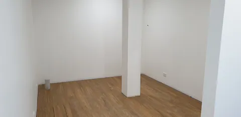 Flooring completed in the smaller room.