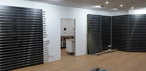 The rear retail wall prepared for product displays.
