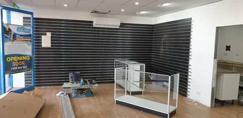 Glass-display cabinet frames brought into the showroom.