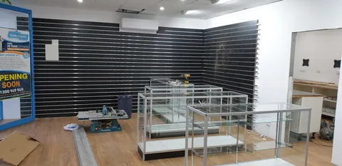 Glass display cabinets partway through assembly.