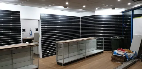 The fitted display walls, counters and glass cabinets.