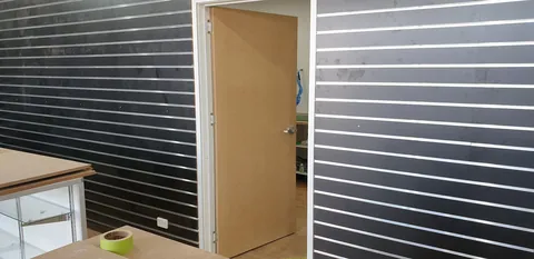 A new internal workshop door hung during the fit-out.