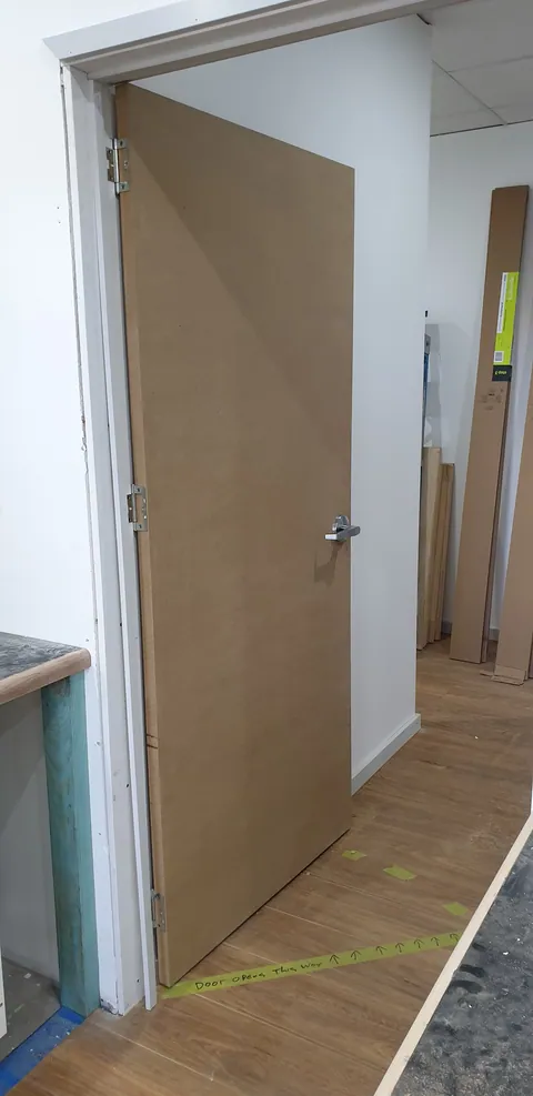 The new workshop door viewed from the internal passage.