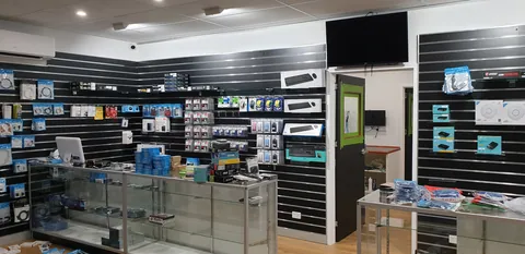 The glass cabinets and wall displays filling with stock.