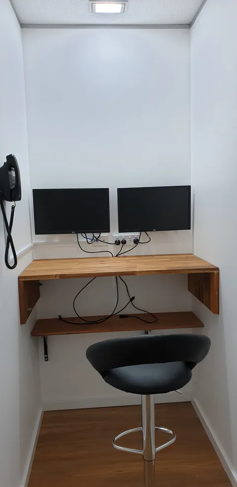 The smaller workstation with its keyboard and bench equipment.