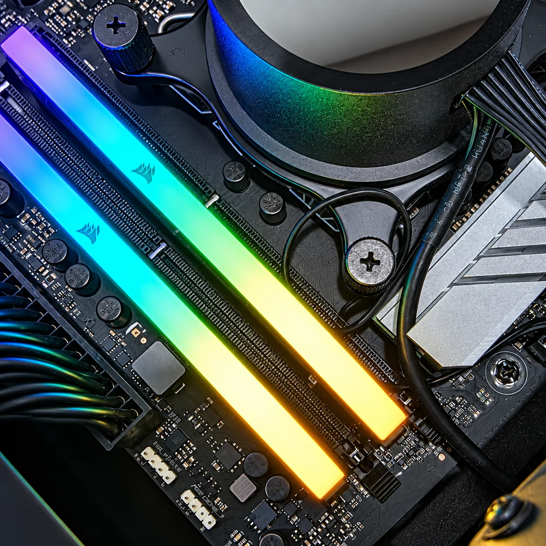 Close view of illuminated memory modules inside a desktop computer.
