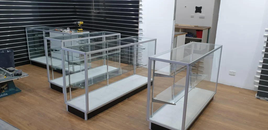 Empty glass display cabinets arranged on the new timber-look showroom floor