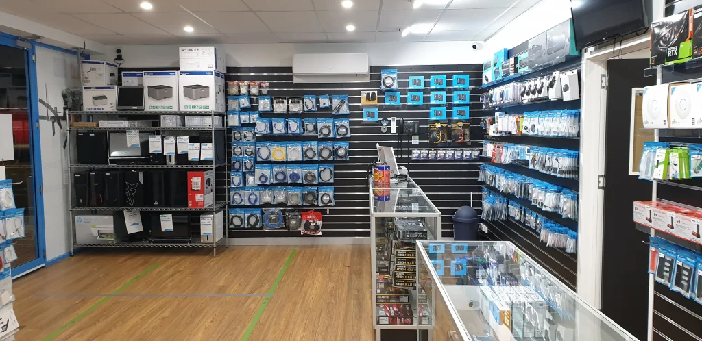 Desktop cases, boxed printers and cable displays in the opposite corner of the Greenway shop