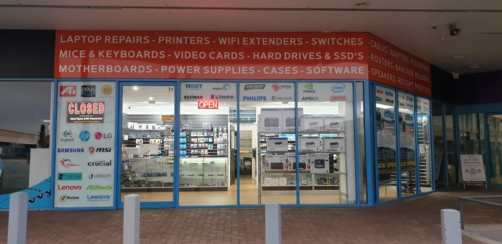 The blue-framed Greenway shopfront and computer parts signage viewed from the foyer